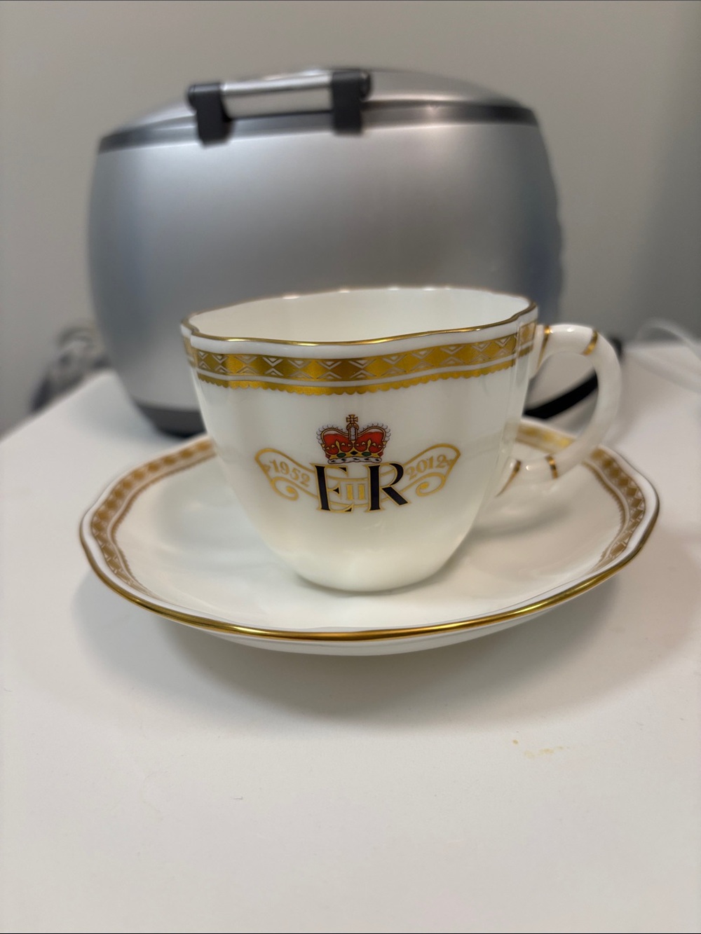 Diamond Jubilee White Porcelain Teacup and Saucer with Gold Accent